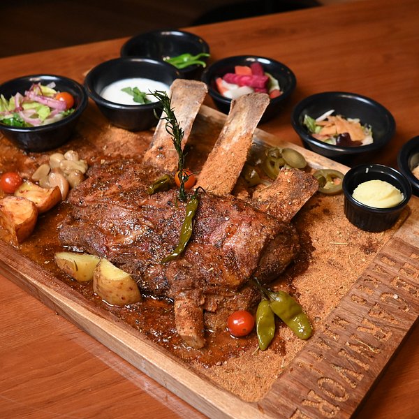 Heavy Muamlat cafe best food best continental food in islamabad best fast food in islamabad best steaks in islamabad logo